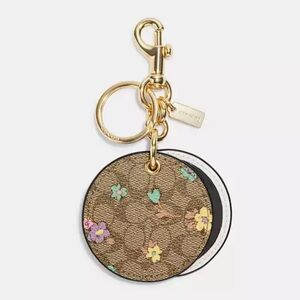 Coach Mirror Bag Charm In Signature Canvas With Spaced Floral Print